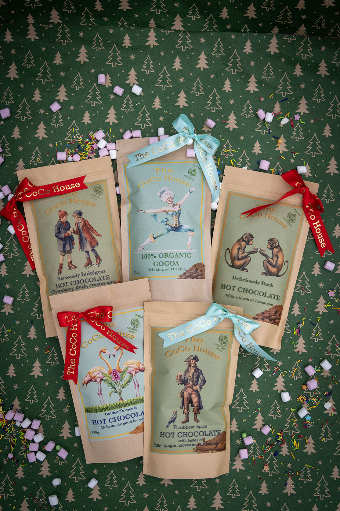 Four types of Coco House hot chocolates balanced on rocks by the seaside Dinan France